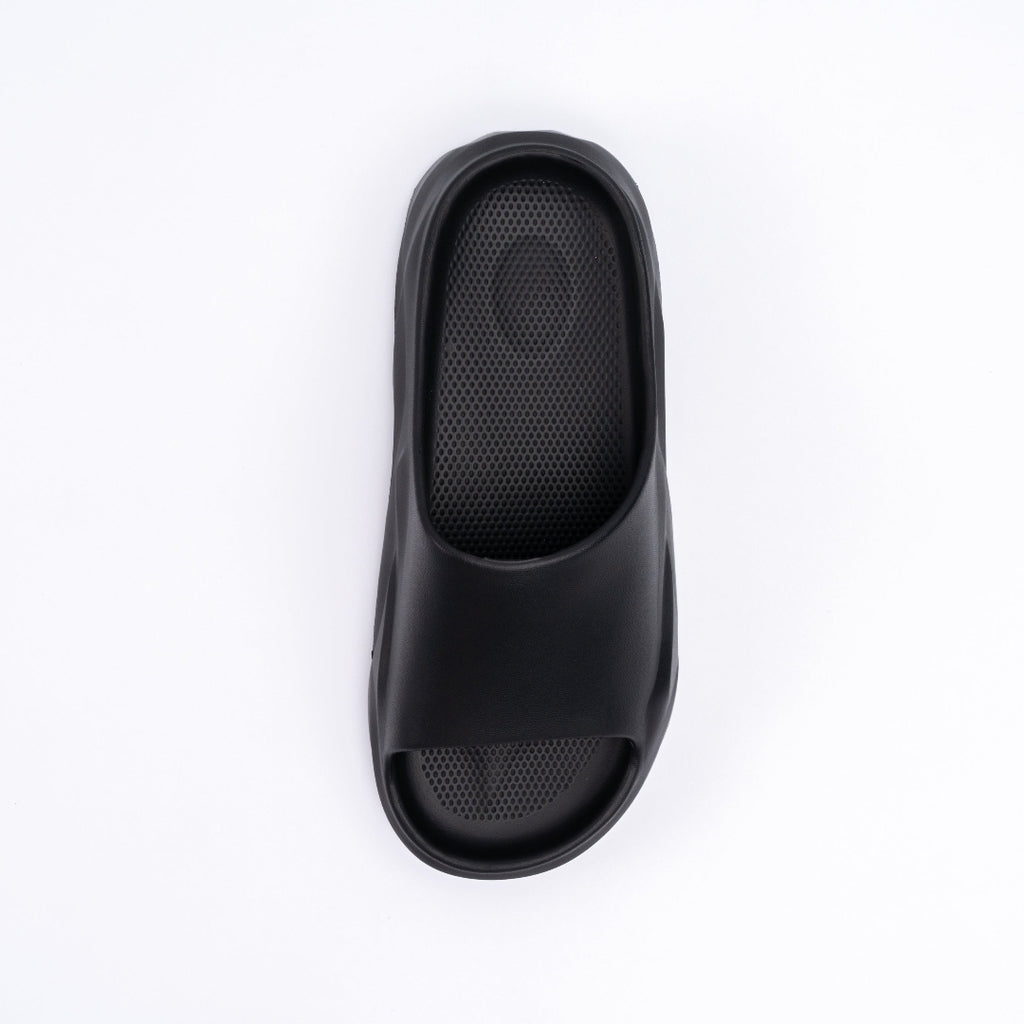 Black slide sandal on a white background