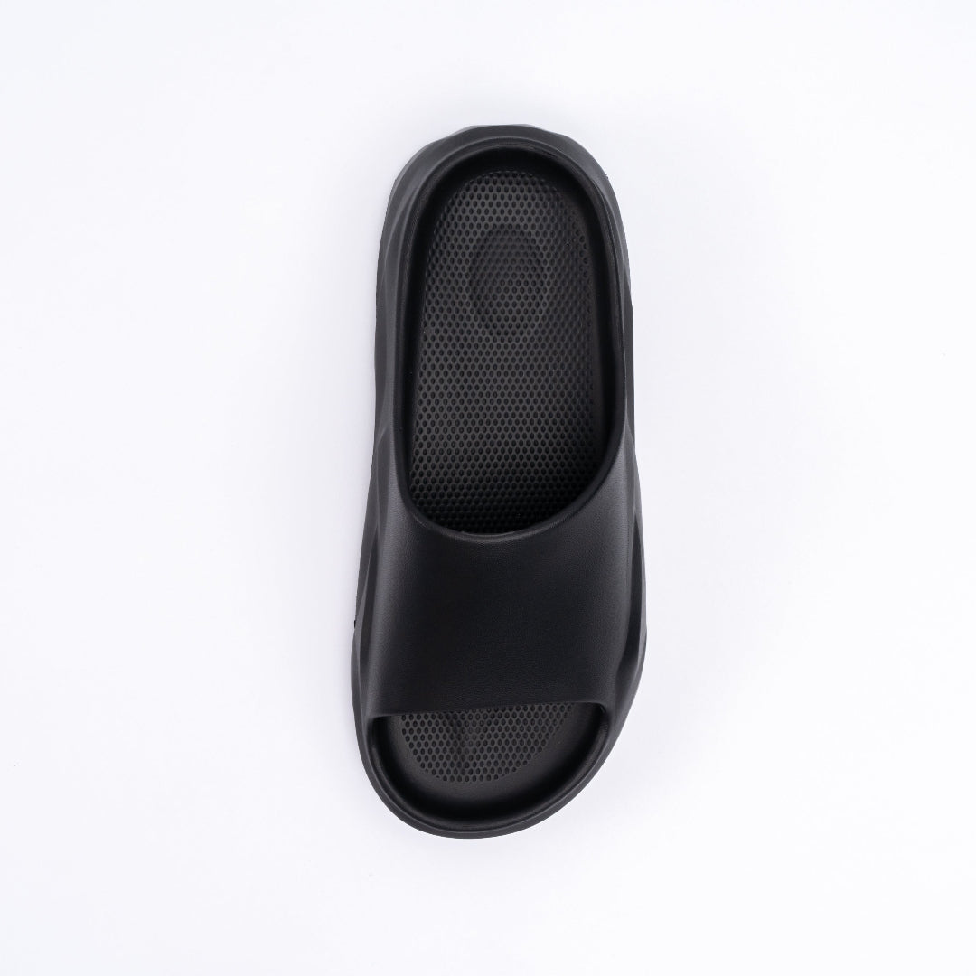 Black slide sandal on a white background