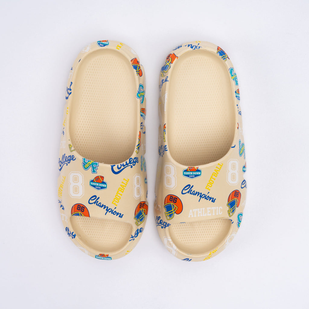 Pair of light-colored sandals with colorful patterns and 'Champion' branding on a white background