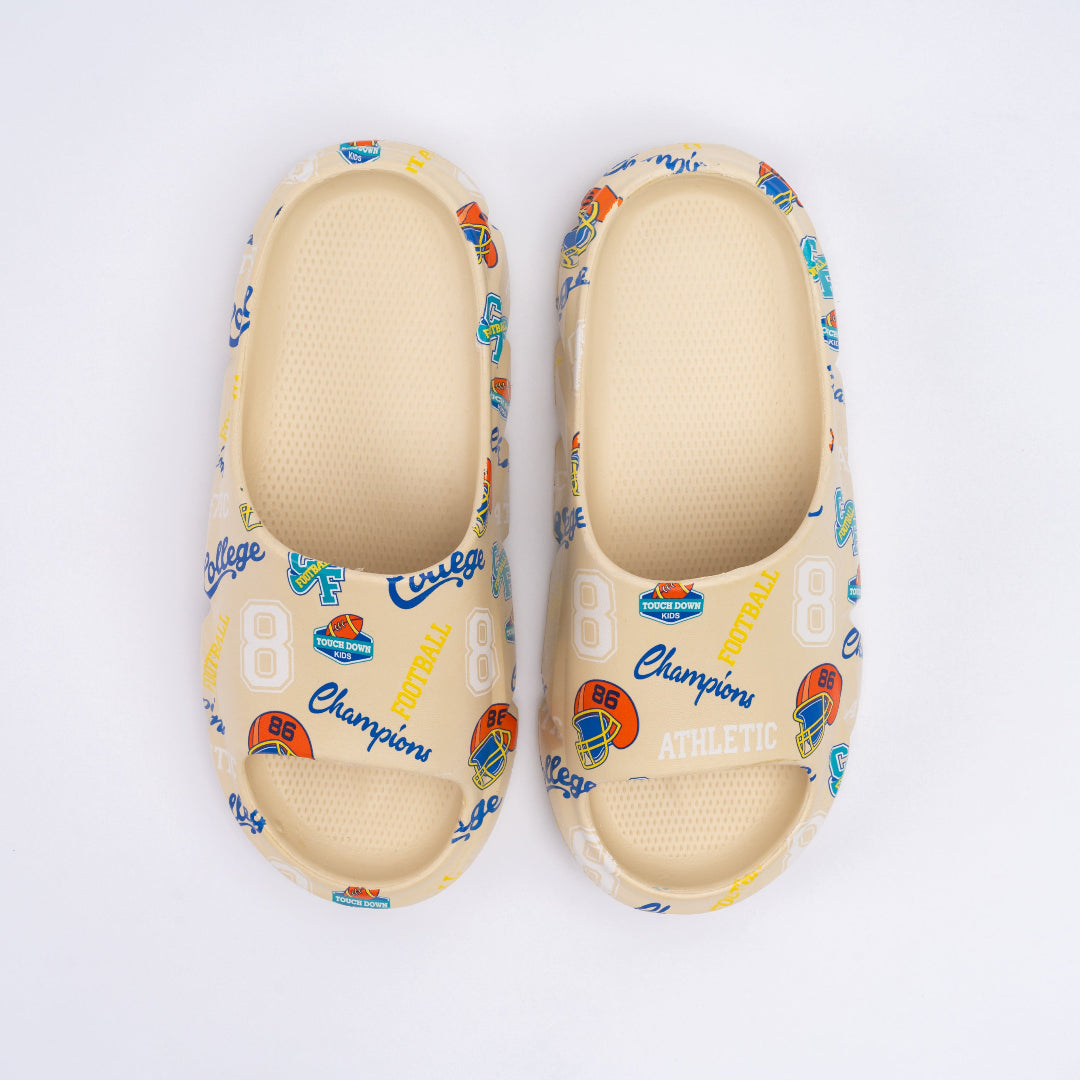 Pair of light-colored sandals with colorful patterns and 'Champion' branding on a white background