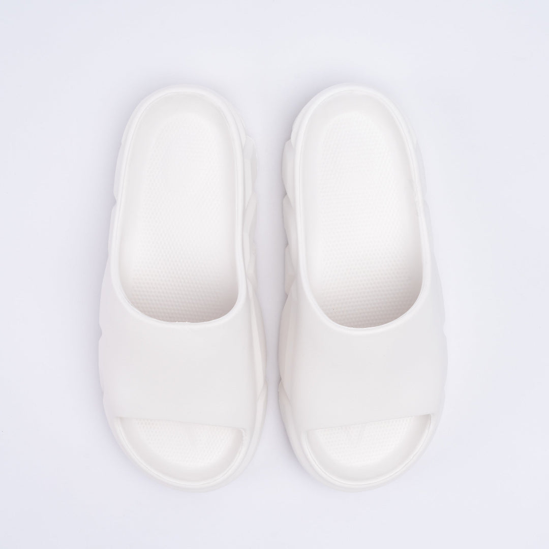 Pair of white slippers on a light gray background