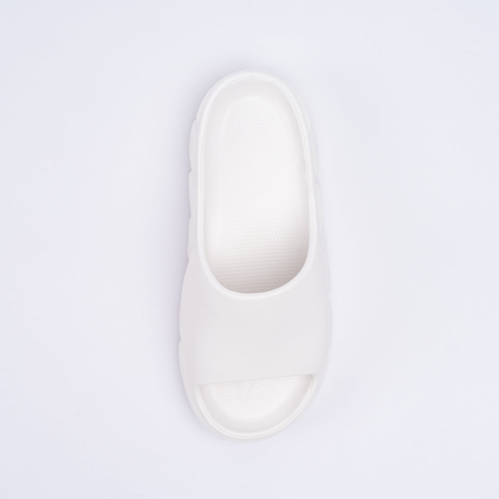 White slipper on a light purple background