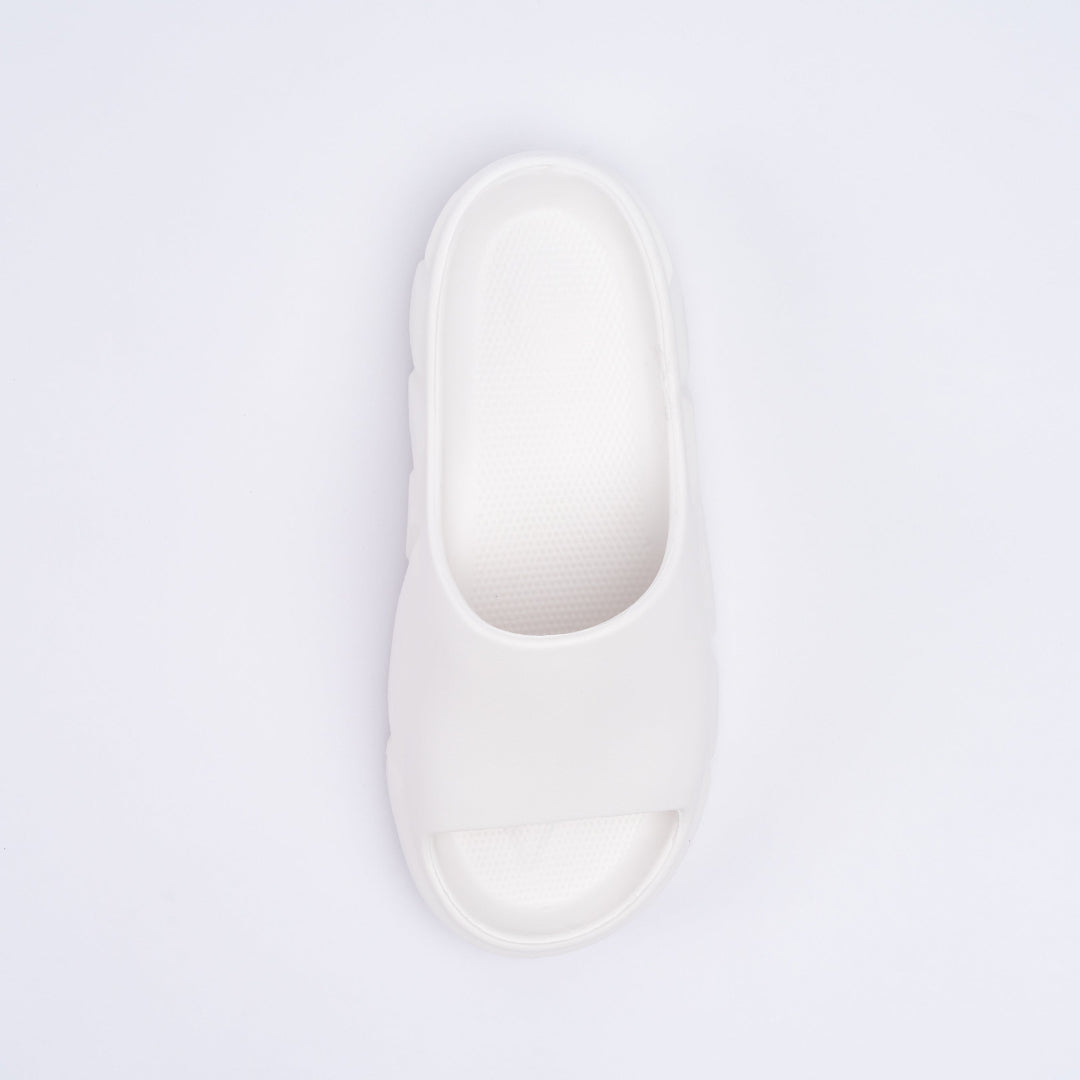 White slipper on a light purple background