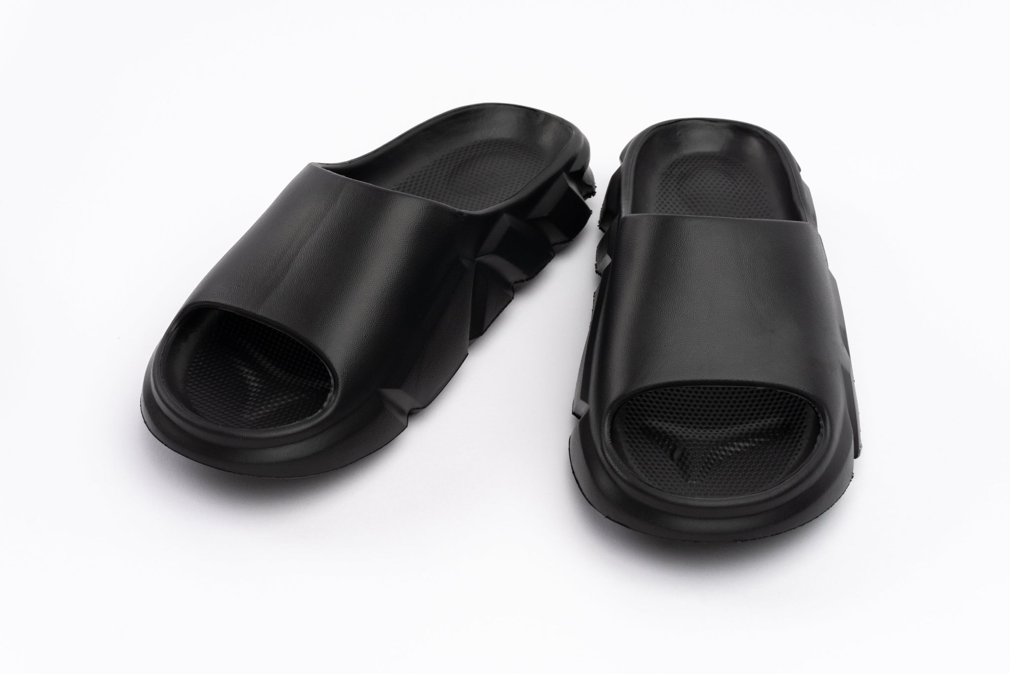 Pair of black slides on a white background