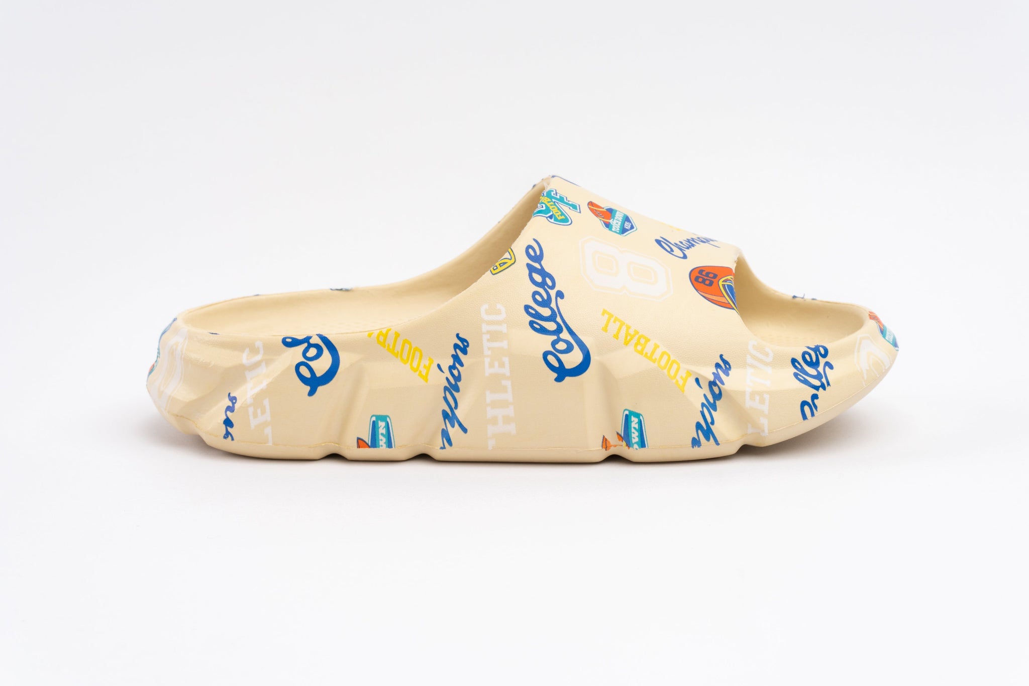 Ceramic shoe with colorful text design on a white background