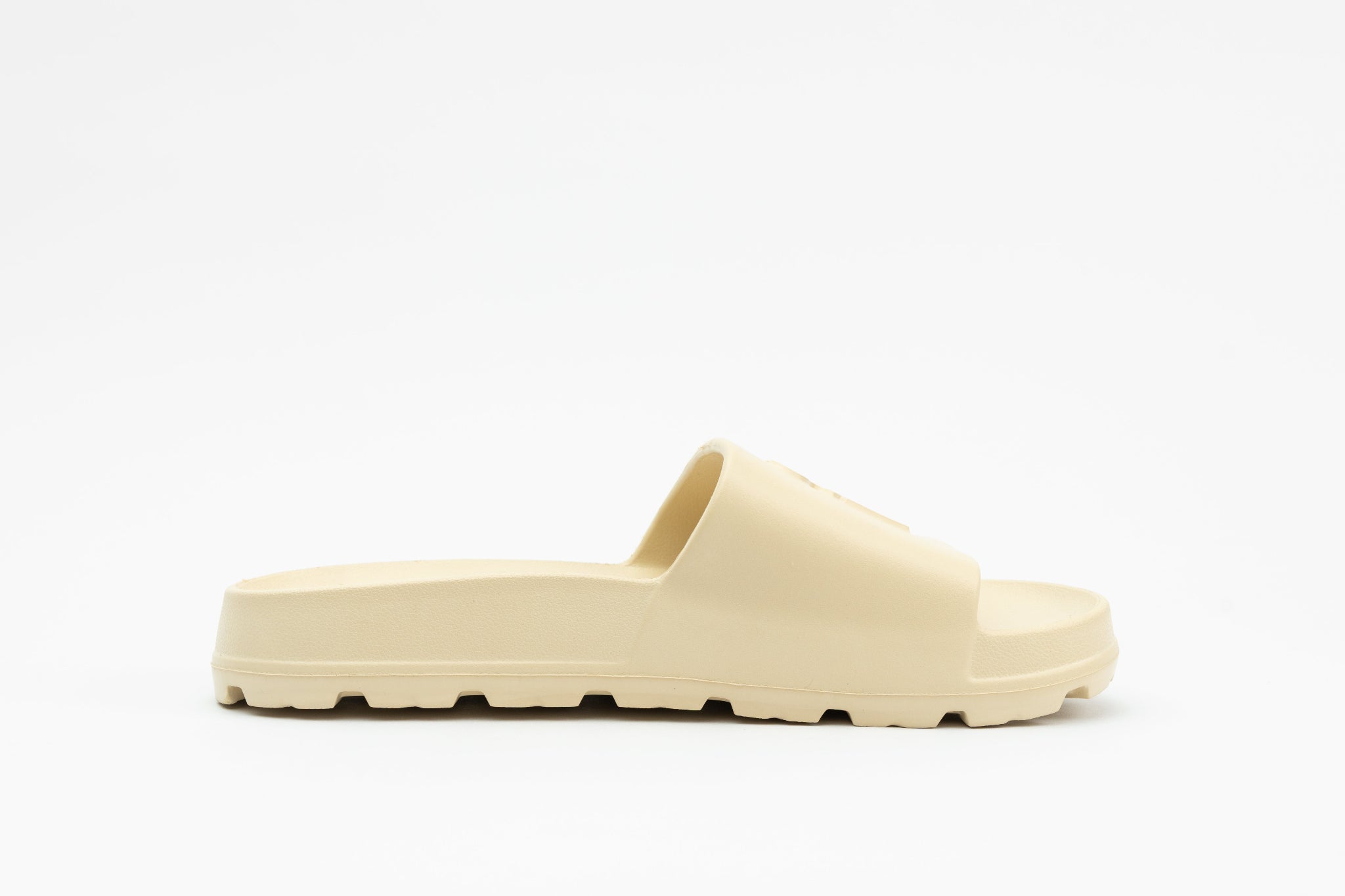 Beige slide sandal on a white background