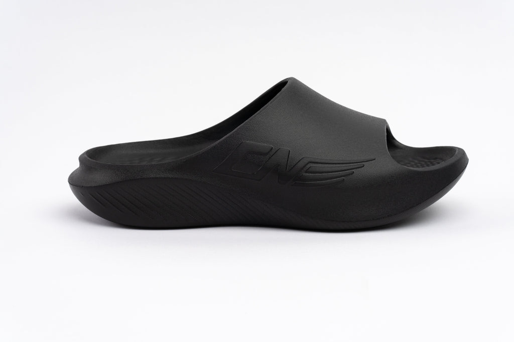 Black sandal with a brand logo on a white background