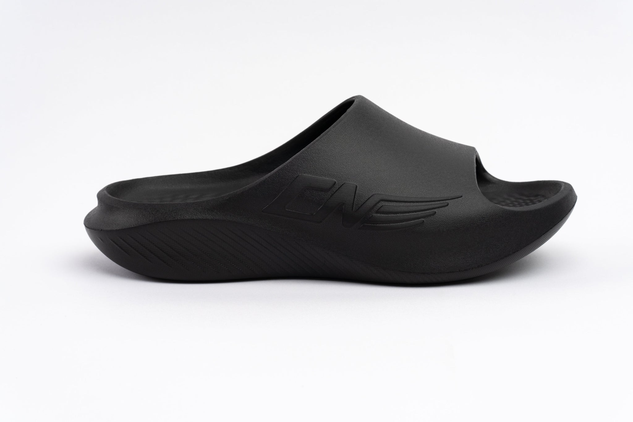 Black sandal with a brand logo on a white background