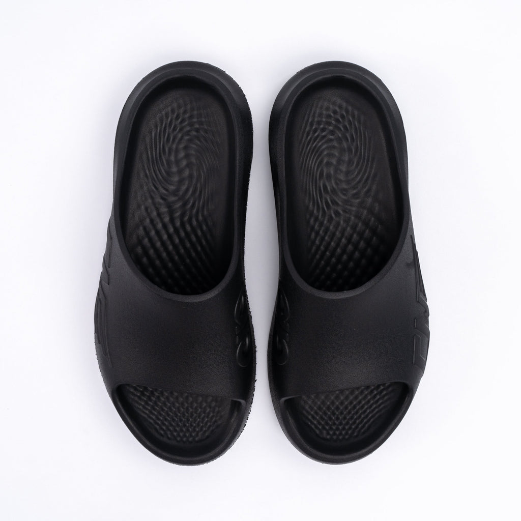 Pair of black sandals on a white background