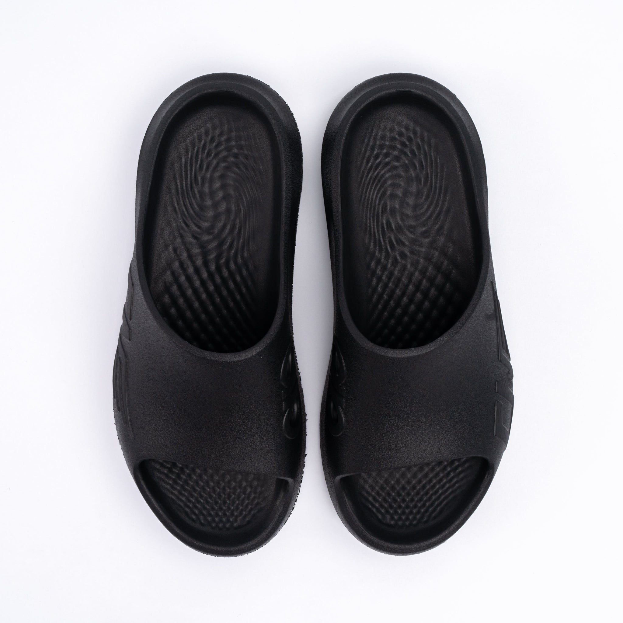 Pair of black sandals on a white background