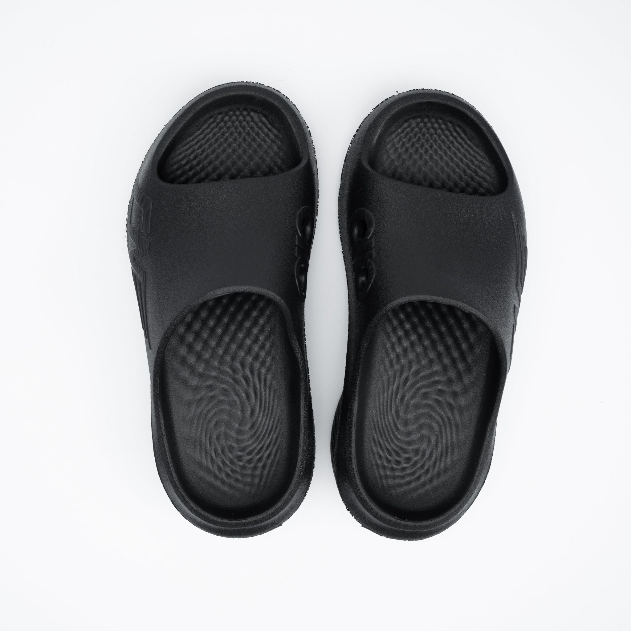 Pair of black sandals on a white background