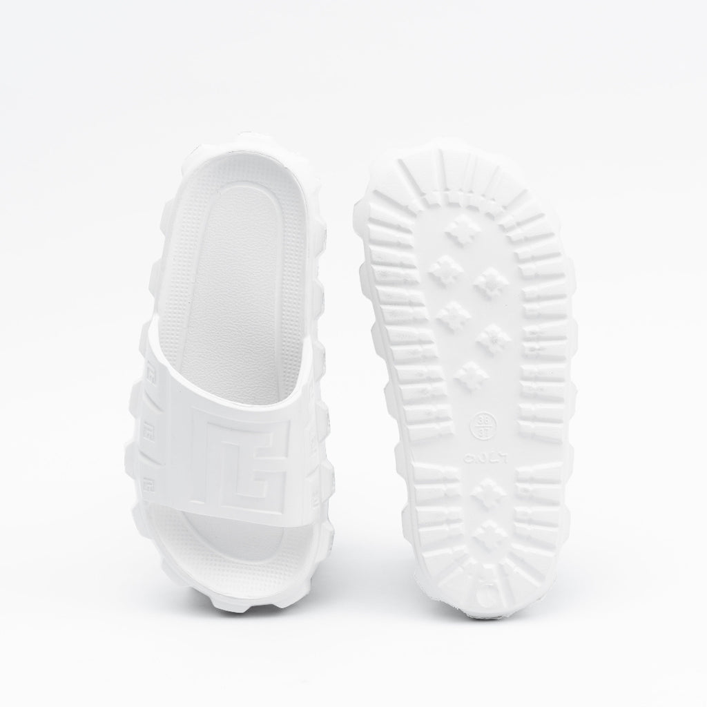White slippers with textured sole on a white background