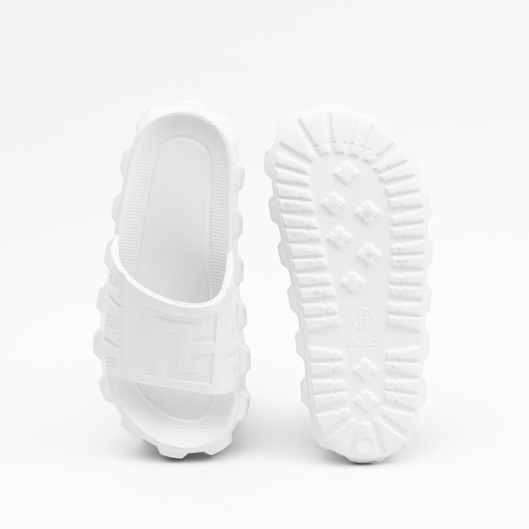 White slippers with textured sole on a white background