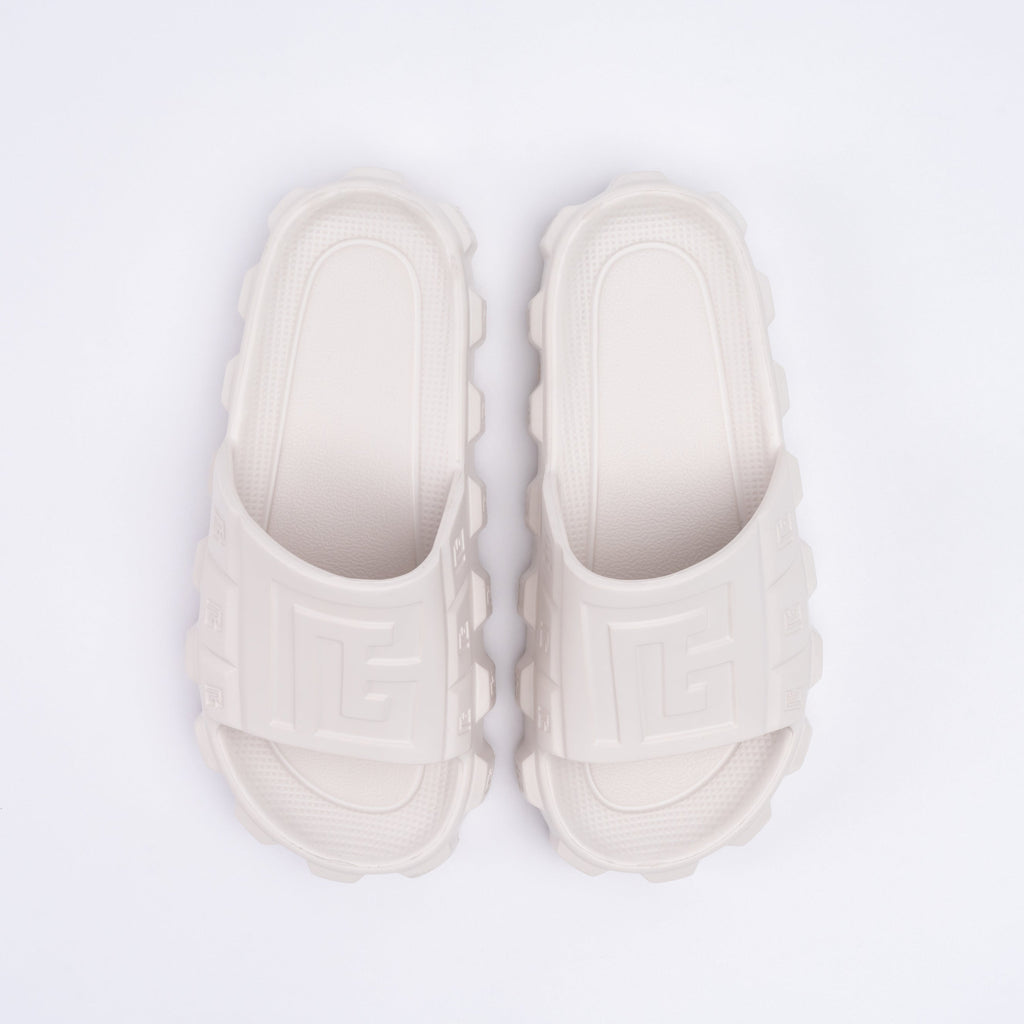 Pair of white sandals on a light gray background