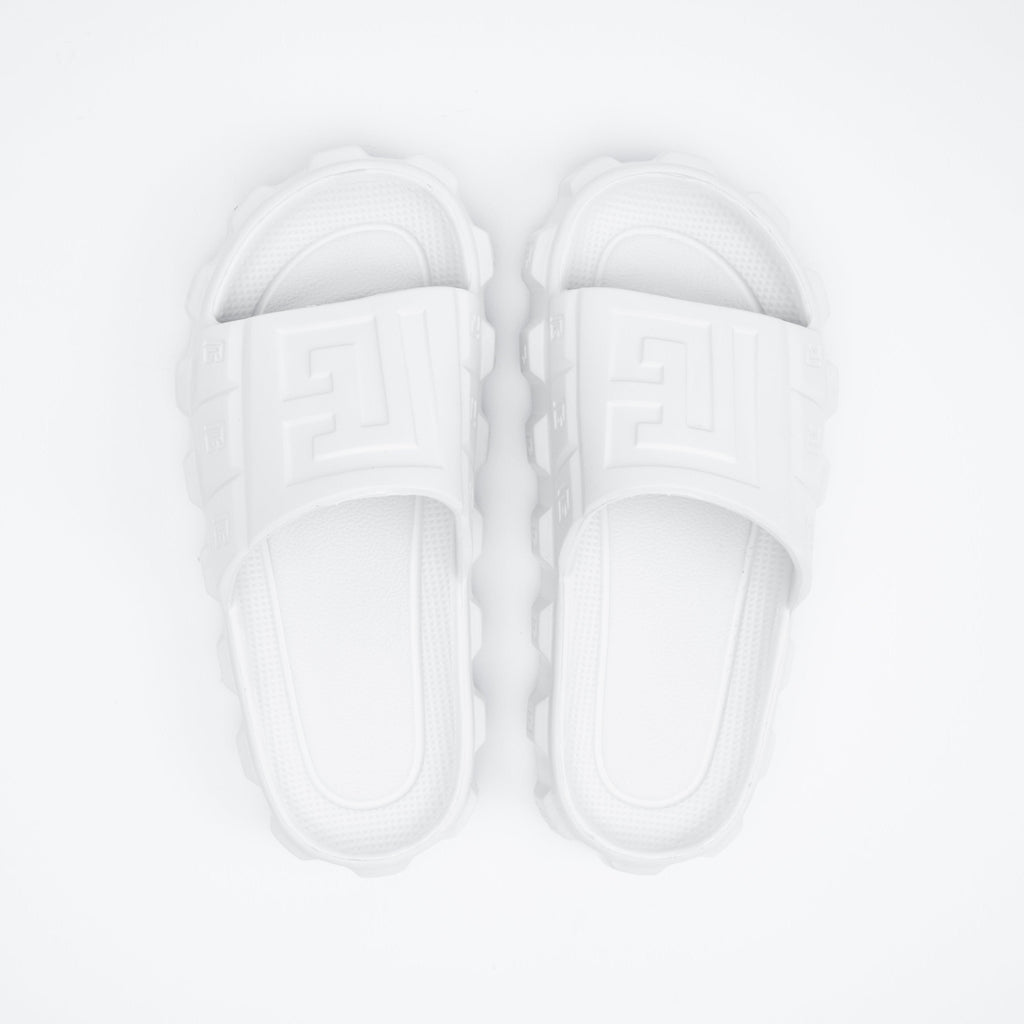 White sandals on a light gray background
