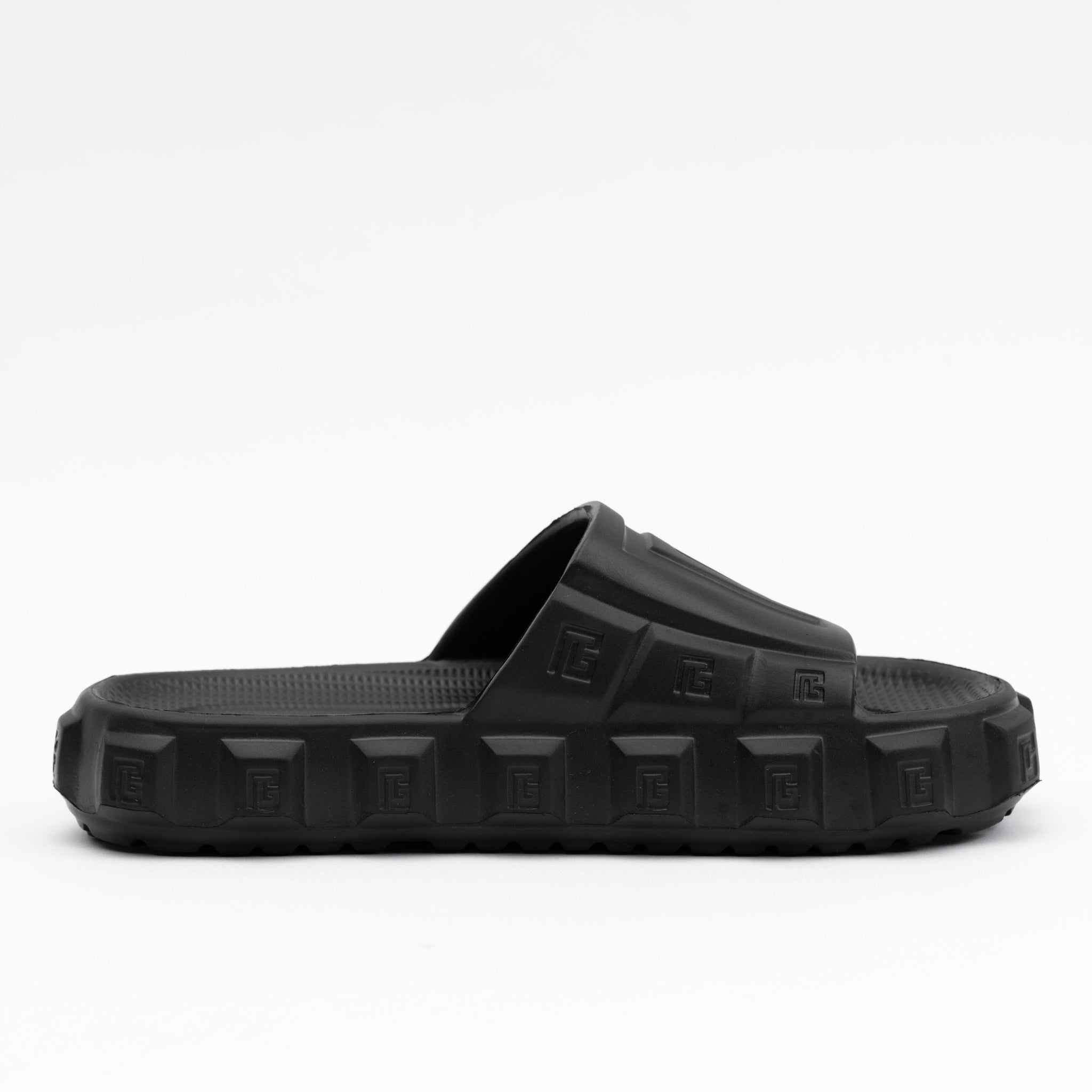 Black slide sandal on a white background