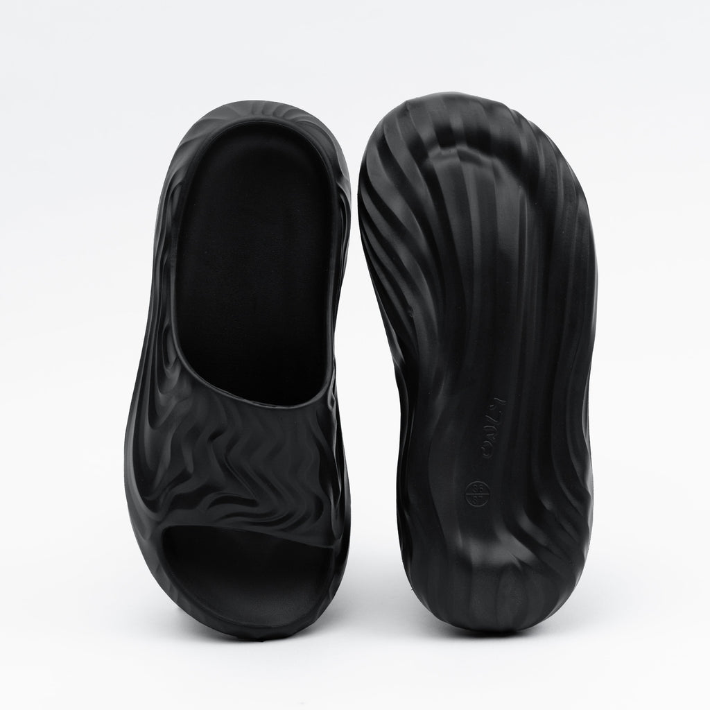 Black shoe covers on a white background