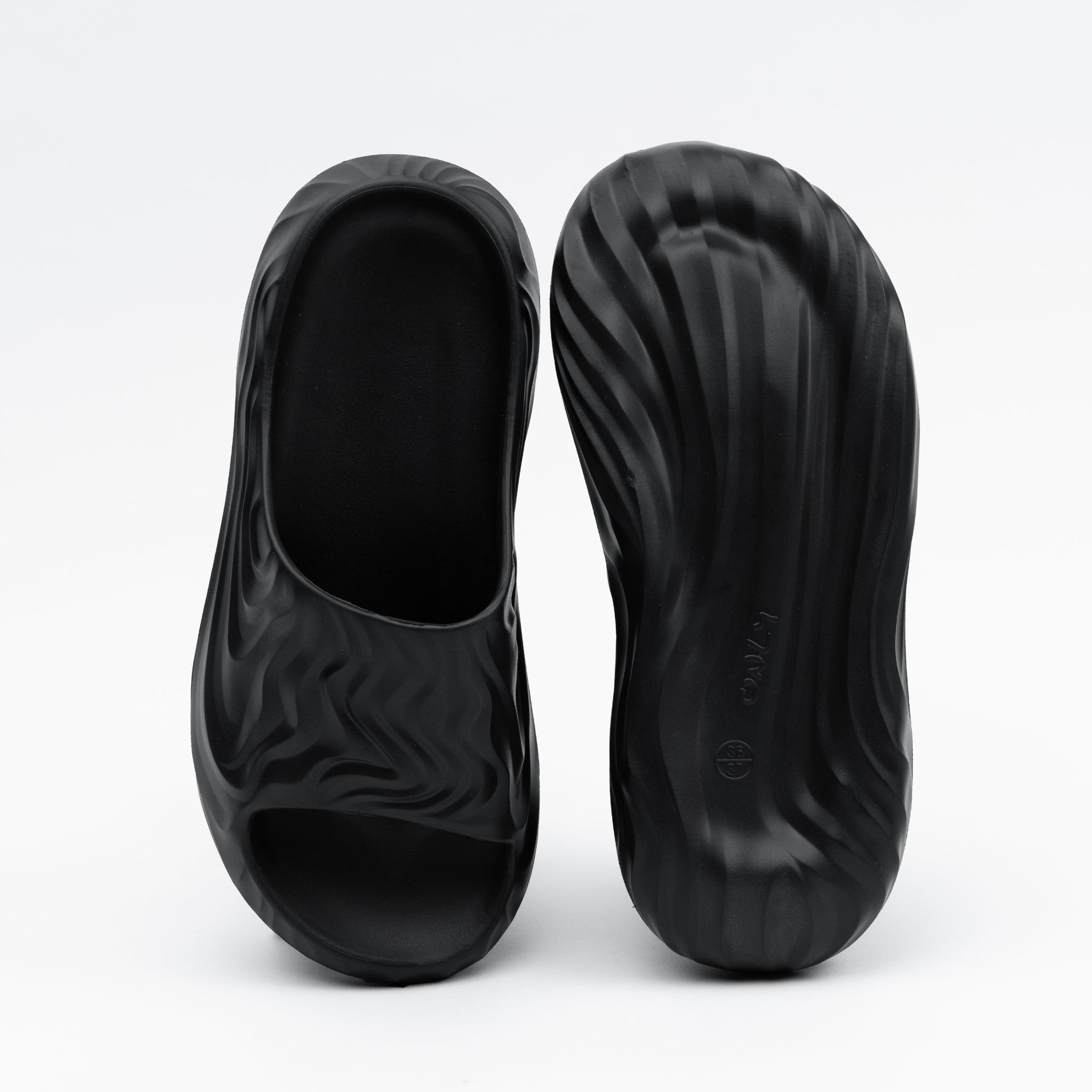 Black shoe covers on a white background
