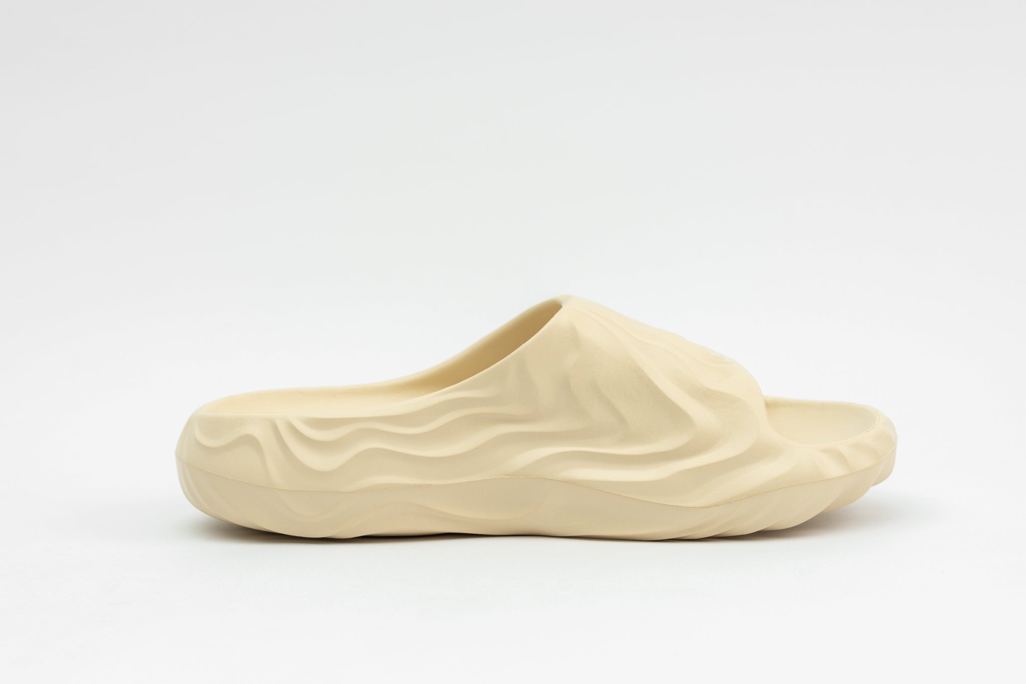 Beige slip-on shoe on a white background