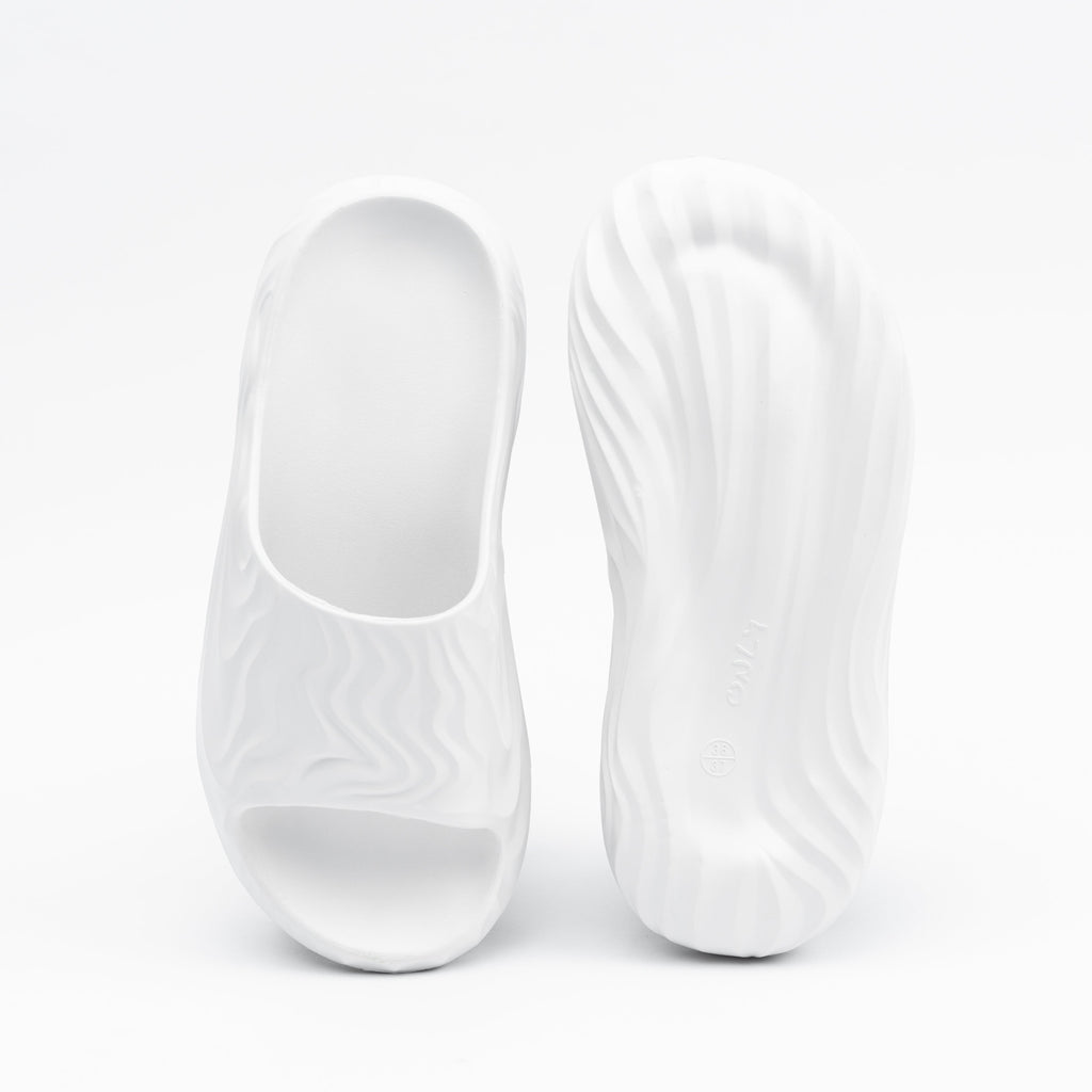 White slip-on shoes on a white background