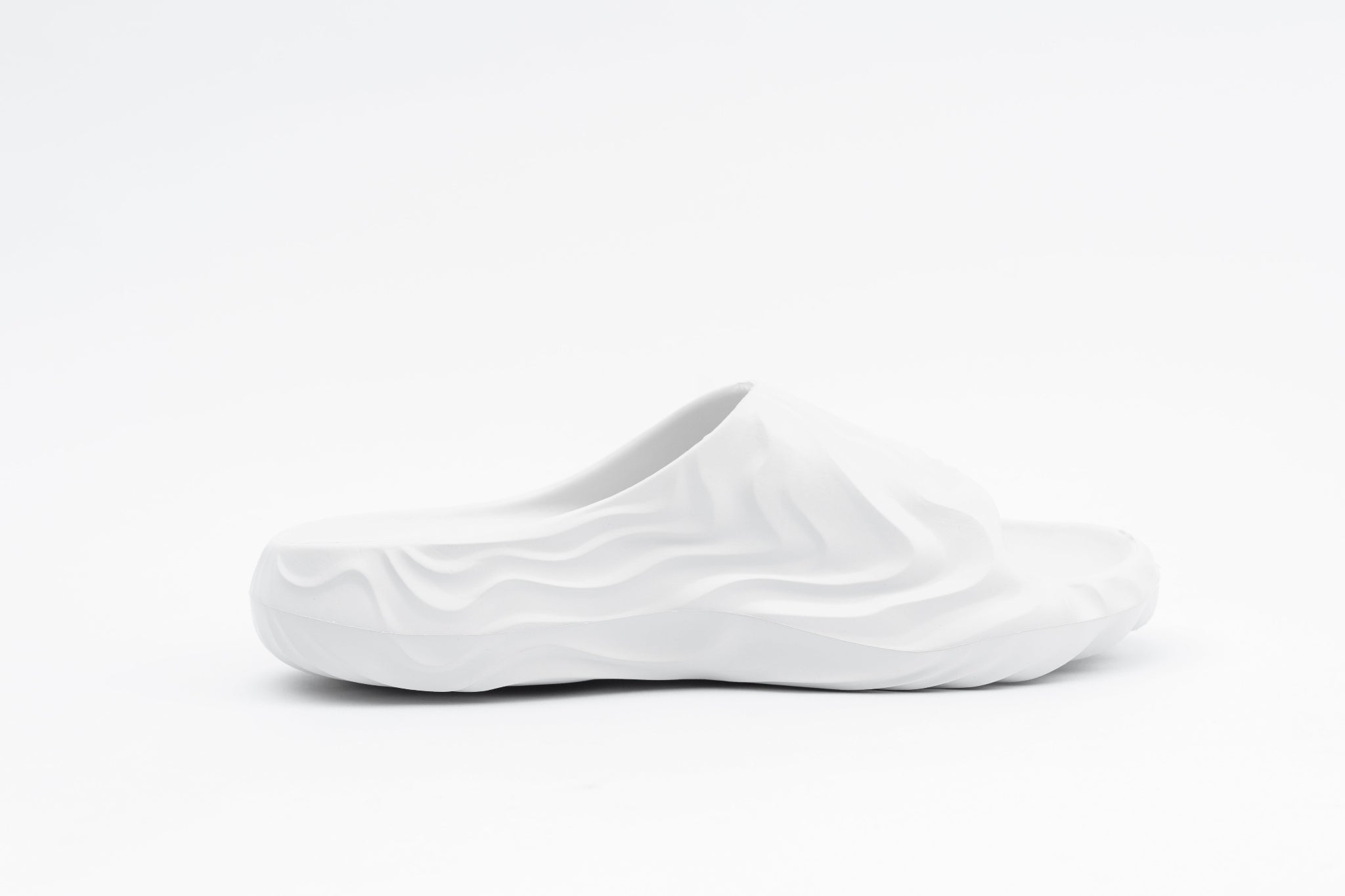 White slip-on shoe on a white background