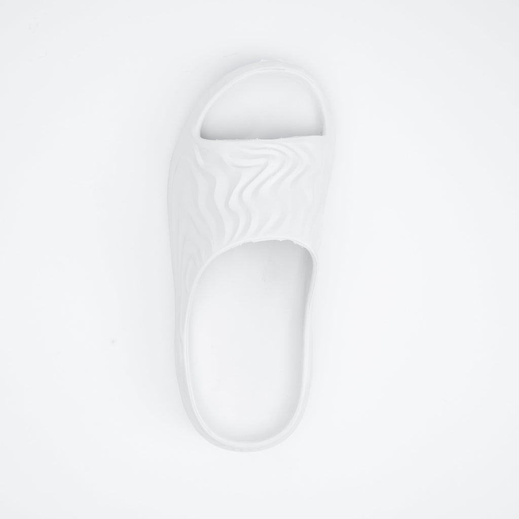 White sandal on a light gray background